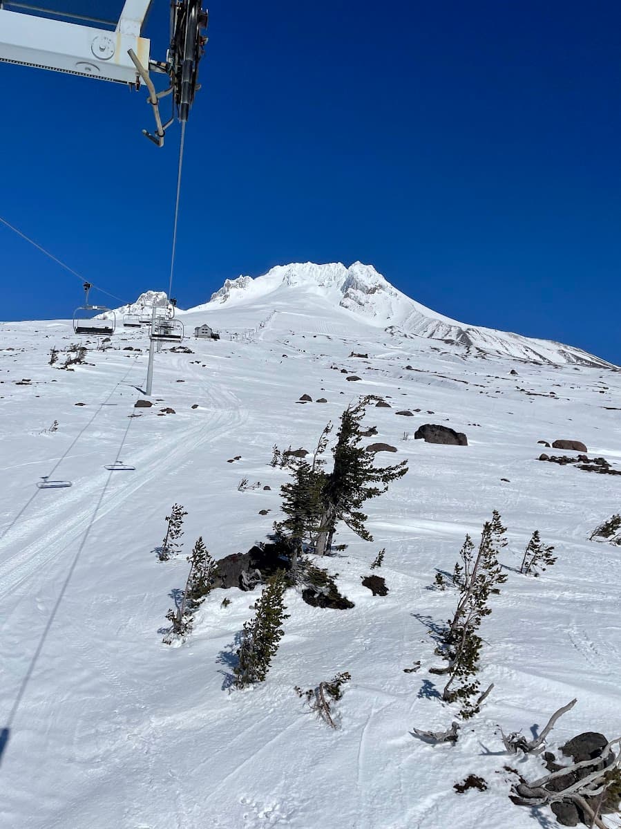 Snowy Mount Hood slope and chairlift